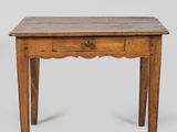 a small wooden table with a drawer on top of it