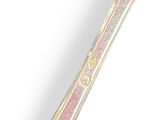 a silver spoon with a pink handle sitting on a white surface