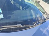 a car that has a sticker on the windshield of it