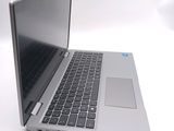 a silver laptop computer sitting on top of a white table