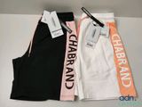 a close up of three pairs of pants with tags on them