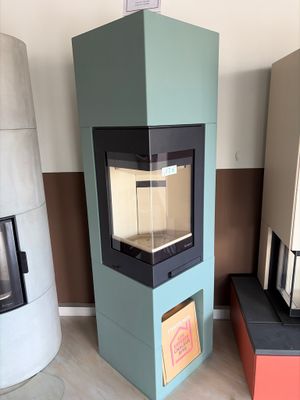 three different types of wood burning stoves in this room