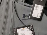 a tag attached to a jacket with a name tag attached to it