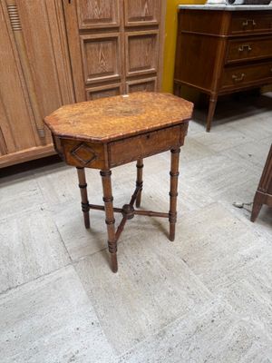 a small table with a wooden top in a room