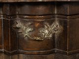 a close up of a wooden table with a clock on it