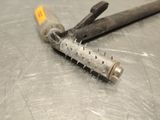 a close up of a tool on a metal surface