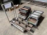 a dolly cart with a lot of items on it