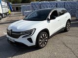 a white suv that is parked in a parking lot