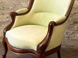 an image of a green chair sitting on top of a brick floor