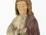 statue of a man holding a bowl and a bowl in his hands