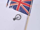 a small british flag and a hook on a white surface