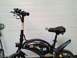 an image of a bicycle parked in front of a garage door