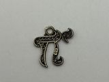 a silver plated charm with the word pi on it