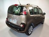 a picture of a car that is parked in a room