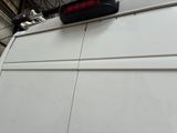 a white van with a red light on top of it
