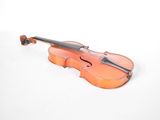 a violin that is sitting on a white surface