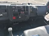 a view of the dashboard of a truck from the driver ' s seat