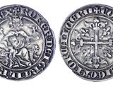 une pièce d'argent avec une croix au recto et une croix au verso