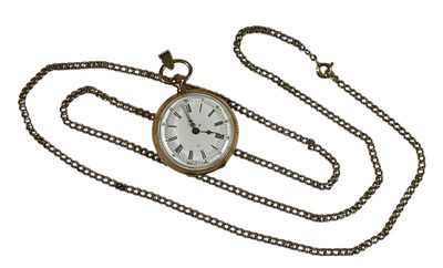 a gold pocket watch with a chain around it on a white background