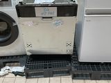 a washing machine and a dryer sitting on the floor