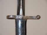 a close up of a metal object with a metal handle