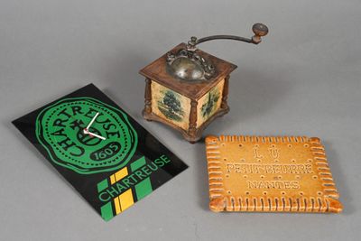 a small clock that is sitting next to a book