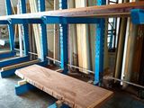 a wooden bench in the middle of a large room