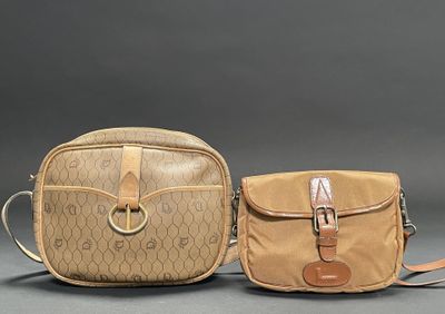 pair of vintage coach purses with monogramming and leather handles