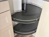 a corner of a kitchen with a sink and a counter top