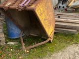 a rusted piece of metal sitting in the grass