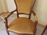 a chair that is sitting in the corner of a room