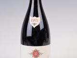 a bottle of wine that is sitting on a table