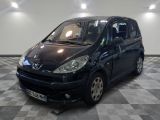 a picture of a small black car parked in a garage