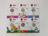 four books on a white surface with a cartoon character on the covers