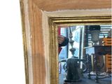 a mirror that is sitting on the floor in front of a rug