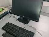 an image of a computer desk with a keyboard and a monitor