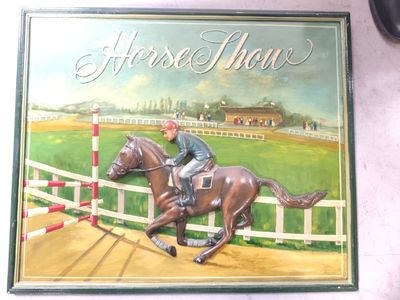 a painting of a man riding a horse on the wall