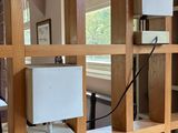 a desk with a computer on it in a room
