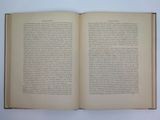 an open book on a white table with a white background
