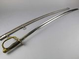 a close up of two swords on a white surface
