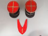 pair of red and black military hats and a pair of red and black ear plugs