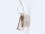 sterling silver pendant with a small square cut diamond on a chain