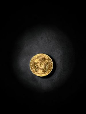 a gold coin on a black background