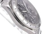 a close up of a watch on a white surface