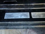 a close up of a black oven with a label on it