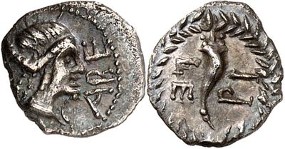 a silver coin with an image of a horse on it
