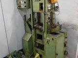 a machine that is sitting in a room next to other machines