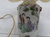 a lamp that is sitting on a table with a lamp shade on it