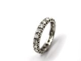 a close up of a silver ring on a white surface