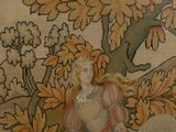 a picture of a tapestry with a woman sitting on a horse